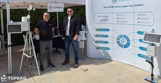 Topraq representatives at an exhibition displaying smart farming technology.